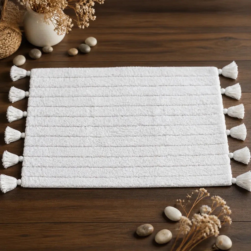 Tapis de bain pompon