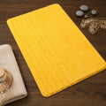 Tapis salle de bain jaune